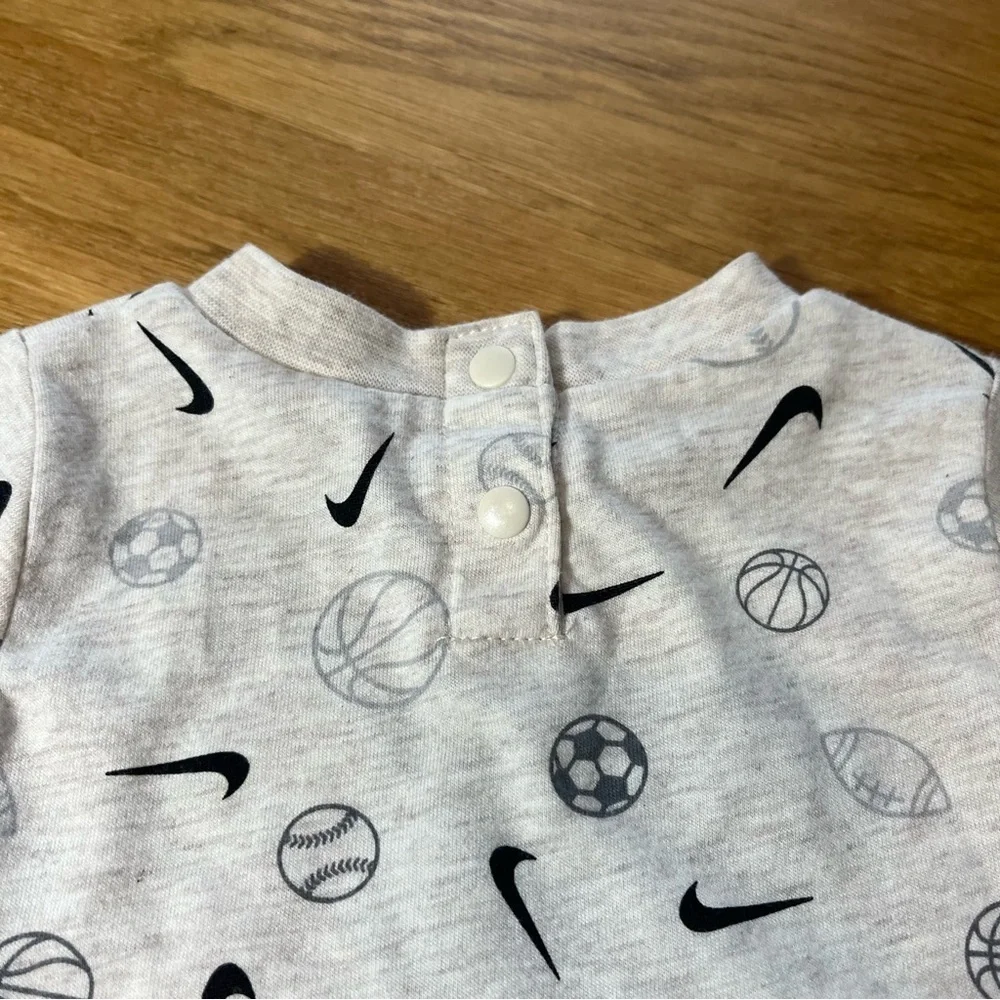 Nike Cream and Black Bodysuit with Short Sleeves and Sports Print